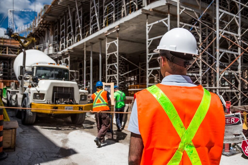 Dedicated construction supervisor in uniform overseeing a project site