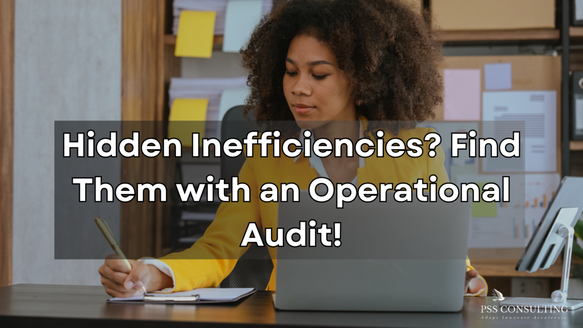 Businesswoman in a yellow blazer analyzing documents at her desk, highlighting the importance of operational audits to identify inefficiencies